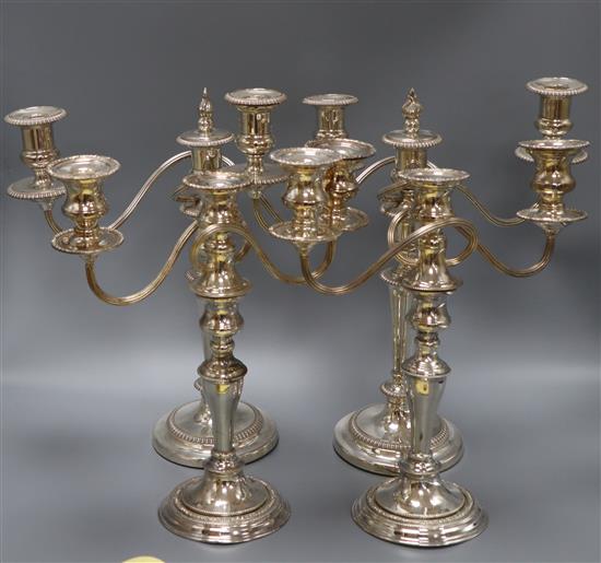 Two pairs of silver plated candelabra